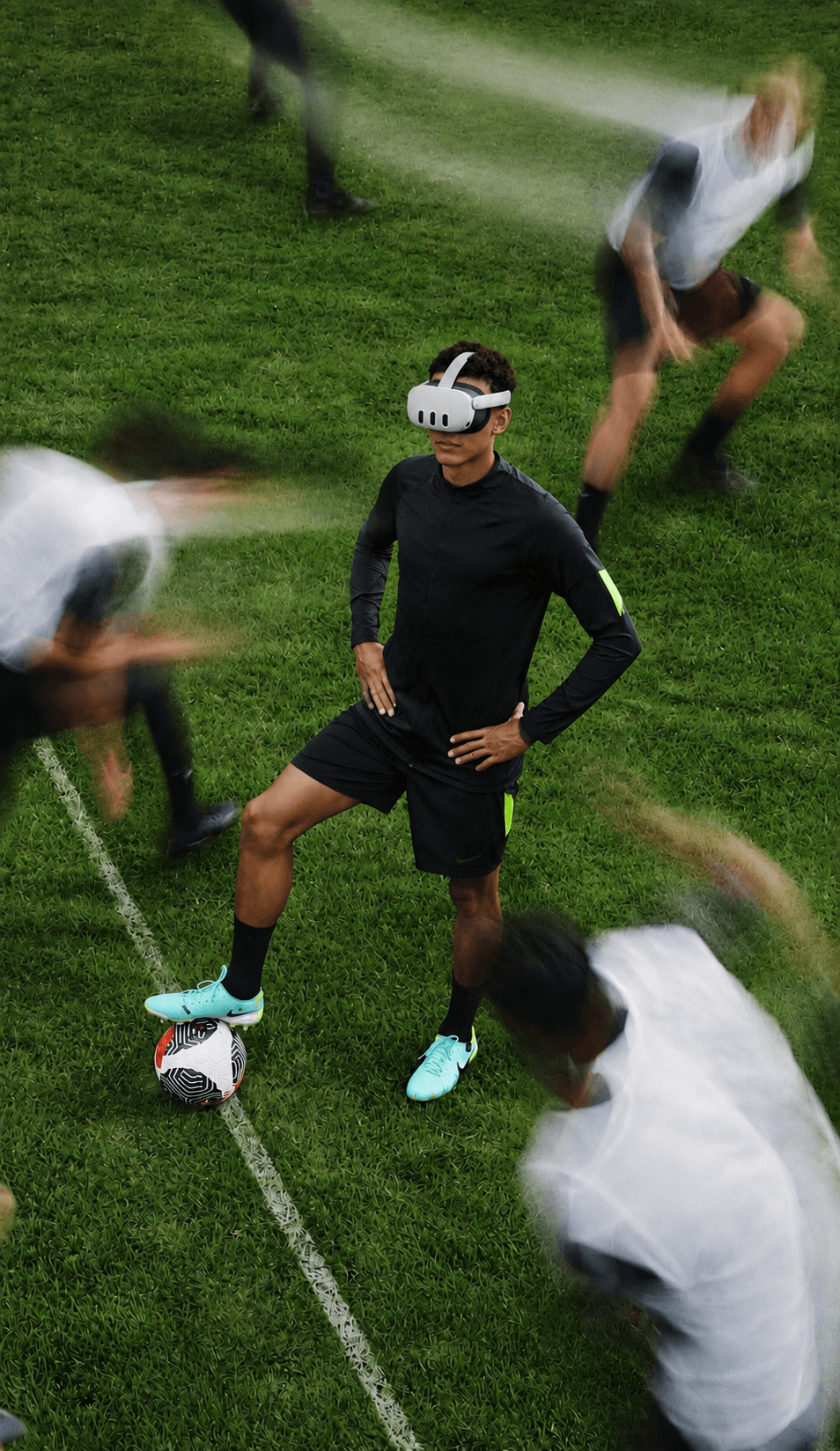 Young player training on the pitch wearing a VR headset